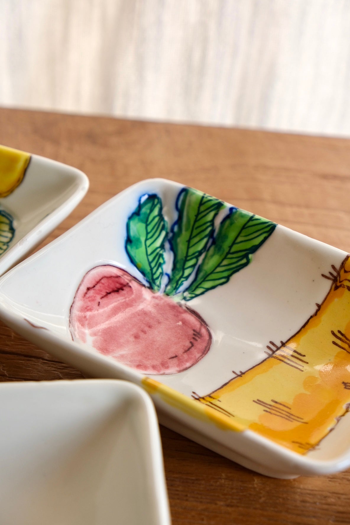 Set of 4 ceramic dishes with hand-painted vegetables