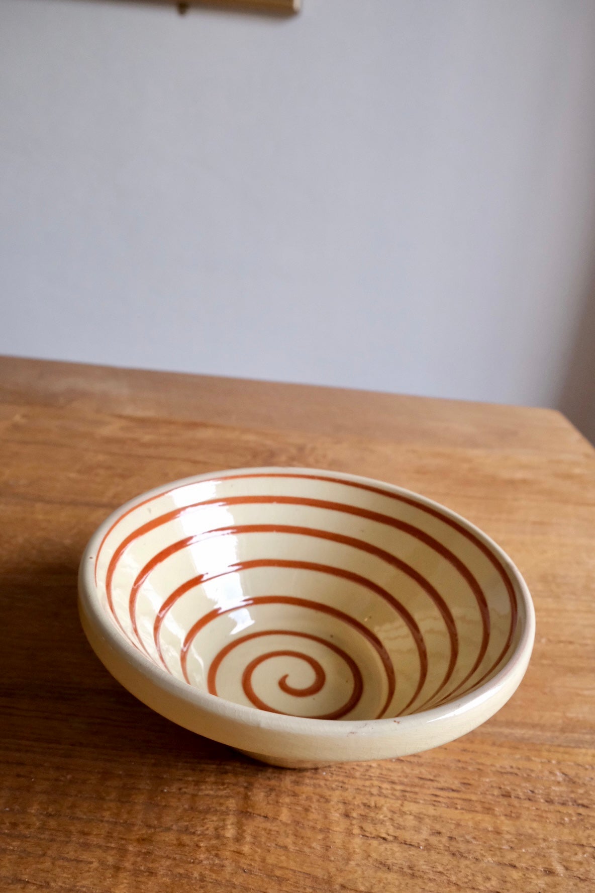 Spanish ceramic orange swirl serving bowl