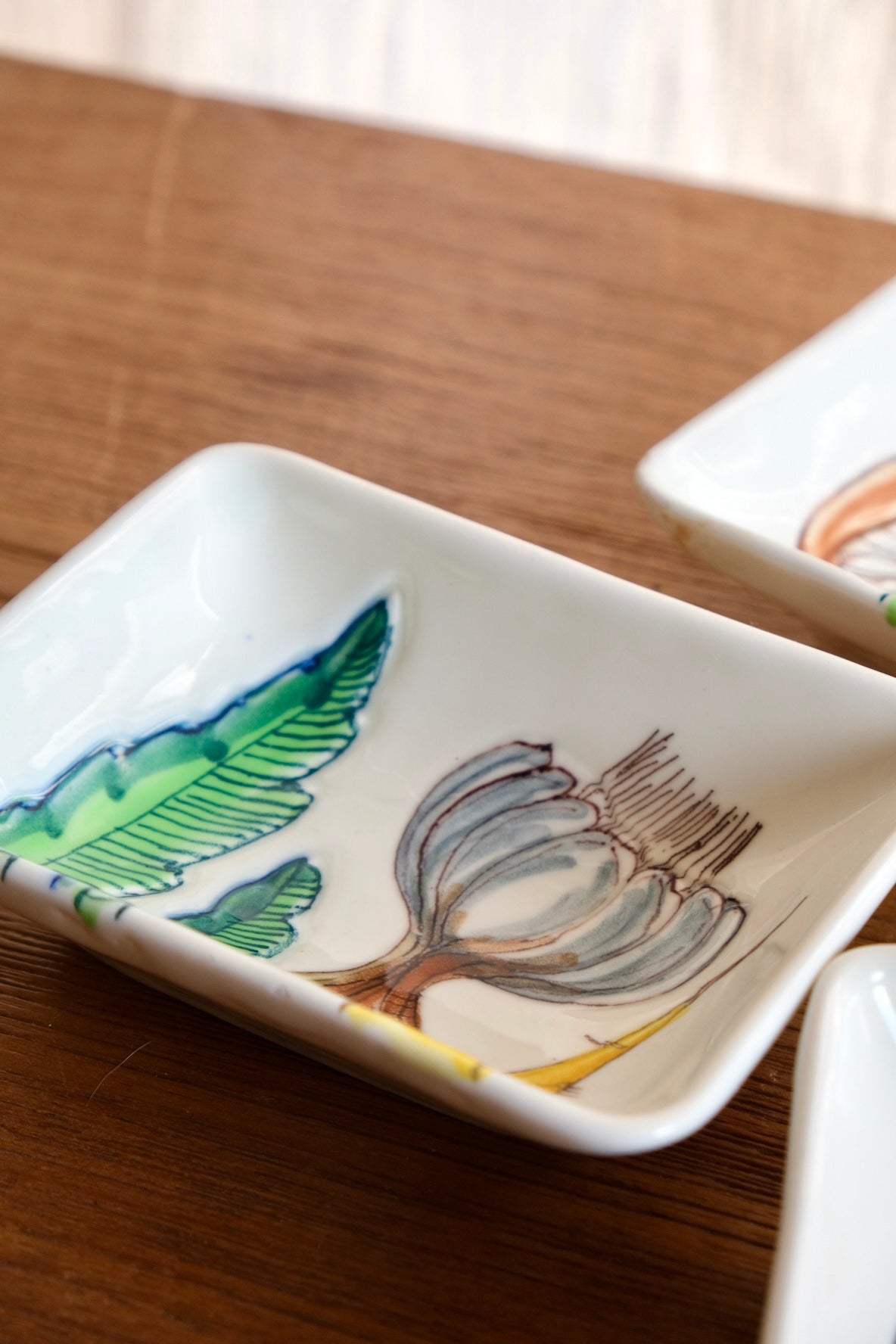 Set of 4 ceramic dishes with hand-painted vegetables