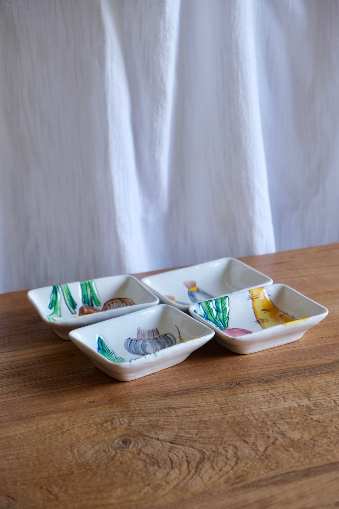 Set of 4 ceramic dishes with hand-painted vegetables