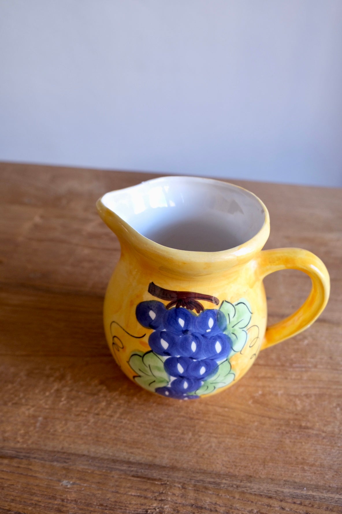 Ceramic jug with hand-painted grapes