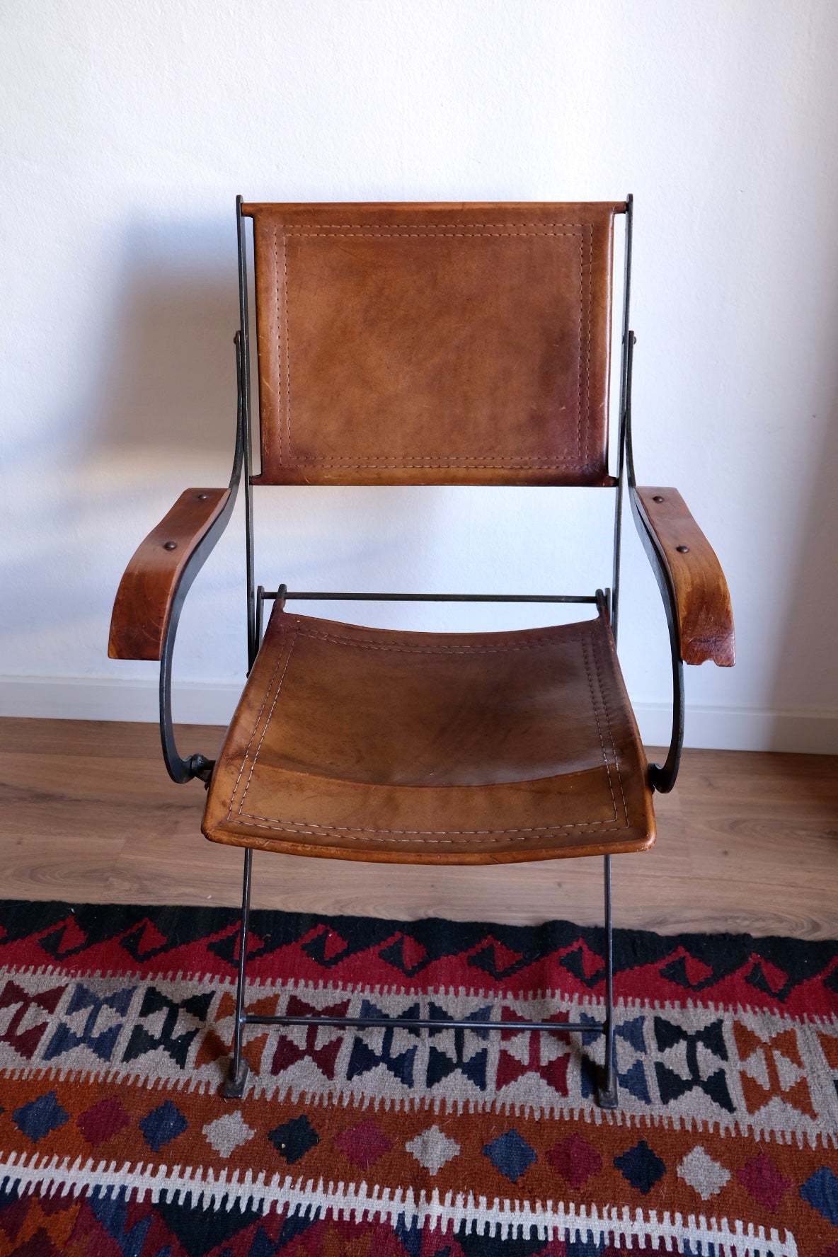 Mid-century foldable chair, leather, wood and iron. France