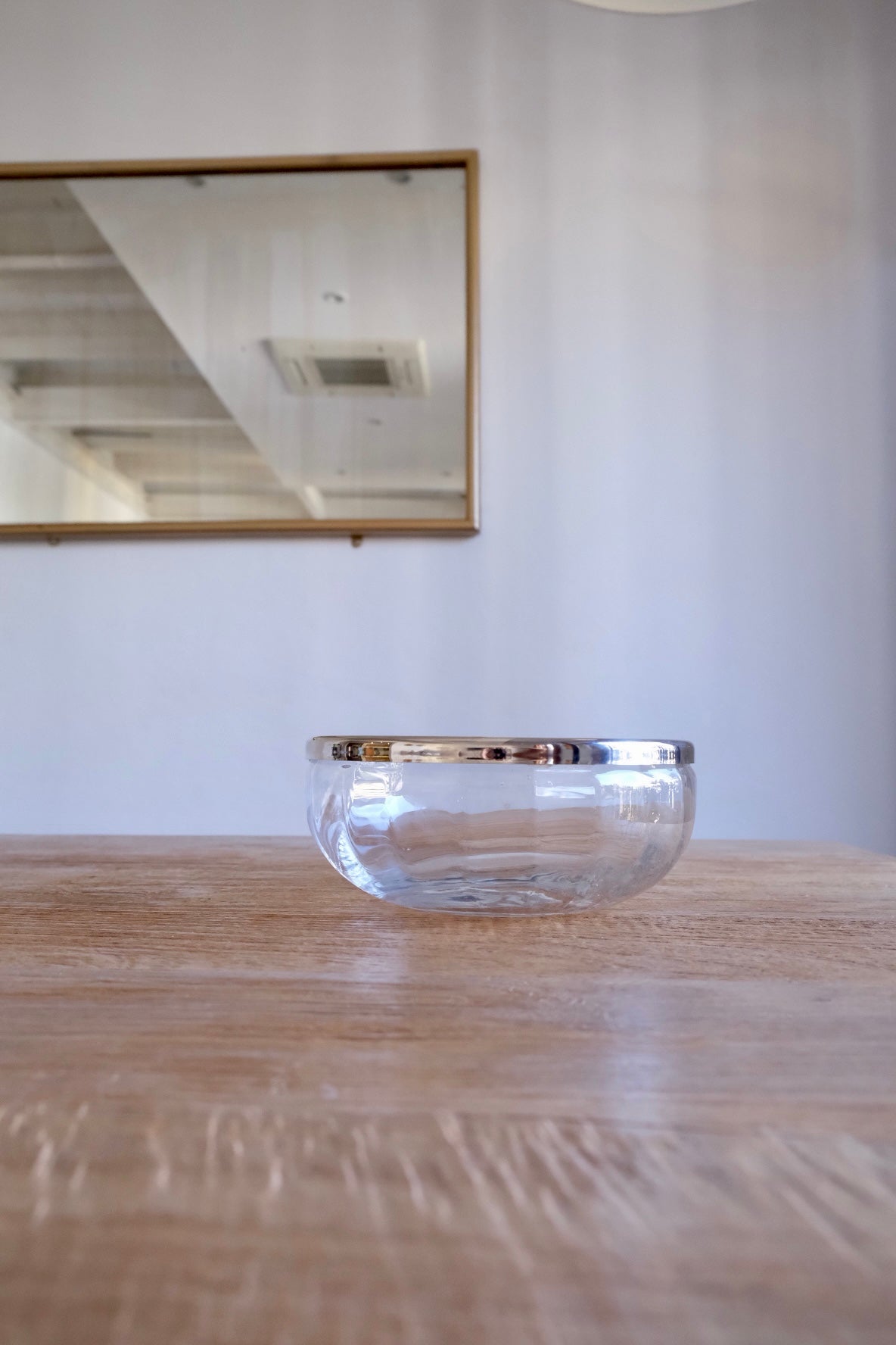 Large glass bowl with silver-plated rim