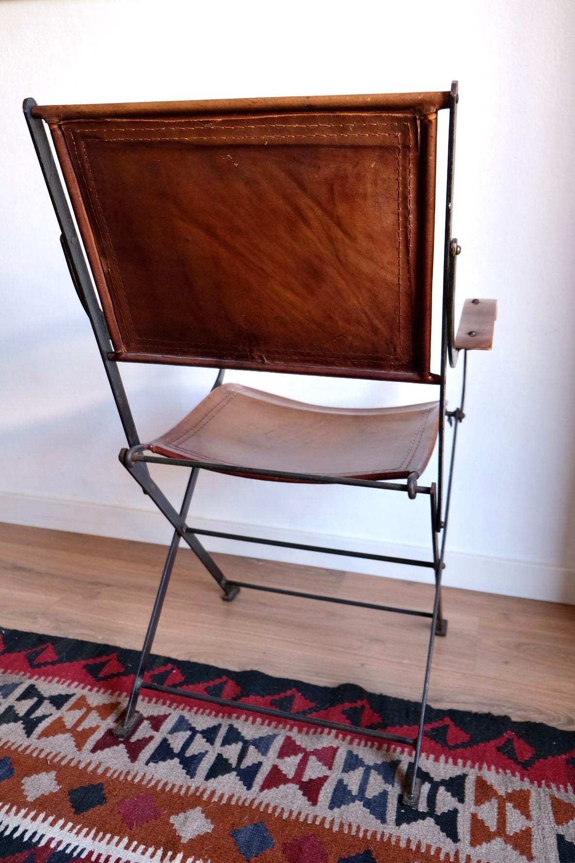 Mid-century foldable chair, leather, wood and iron. France