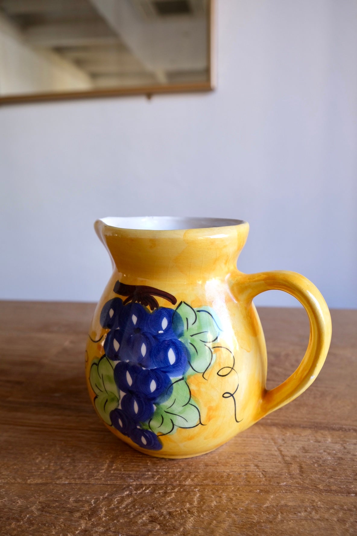 Ceramic jug with hand-painted grapes