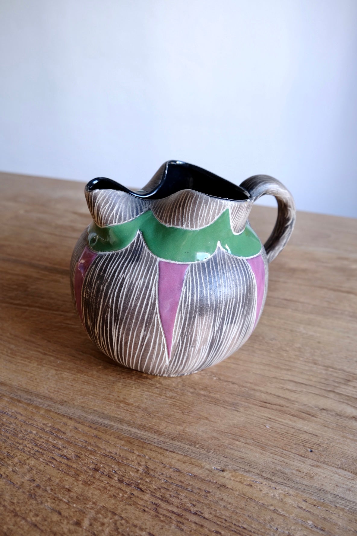 Colourful ceramic water jug