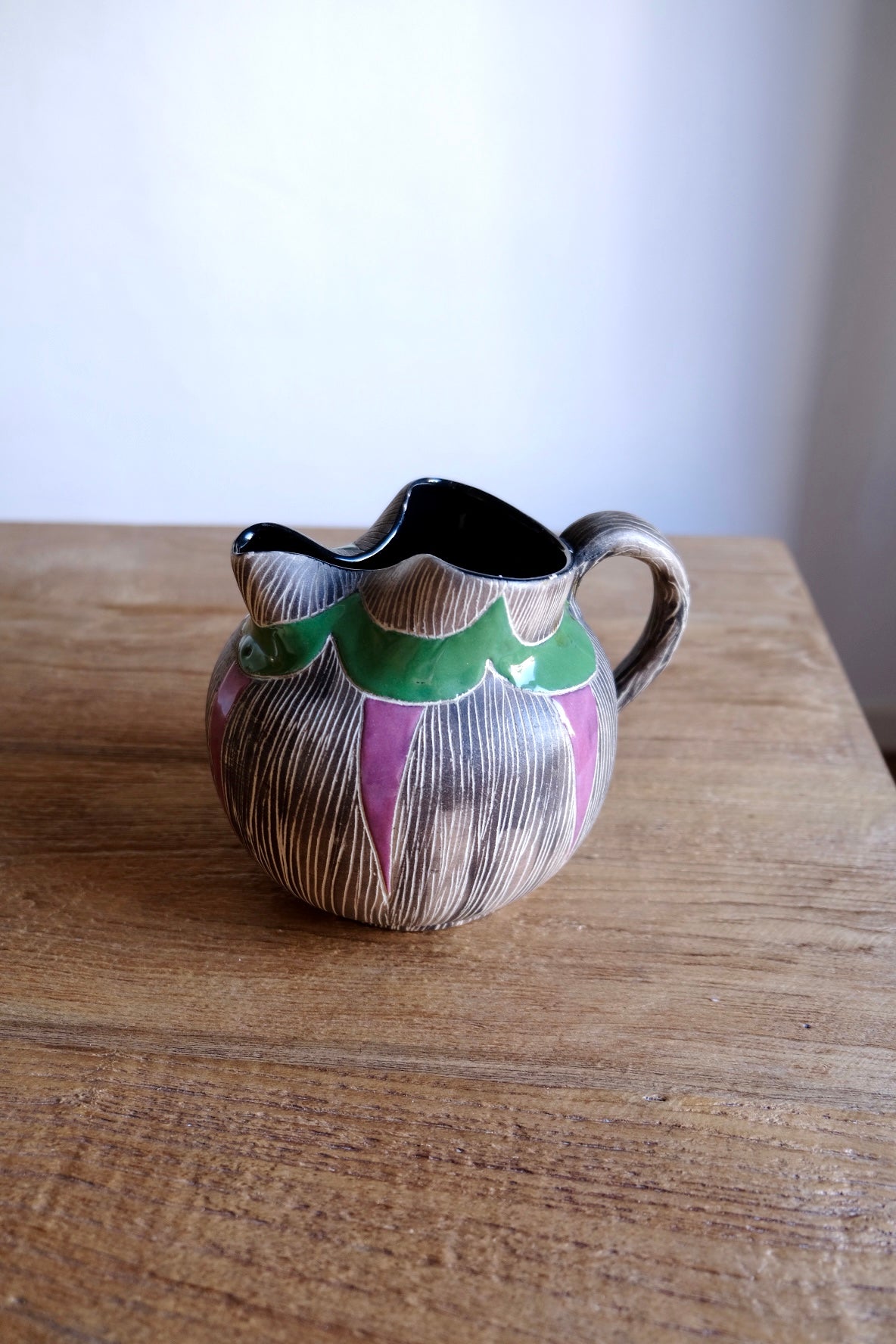 Colourful ceramic water jug