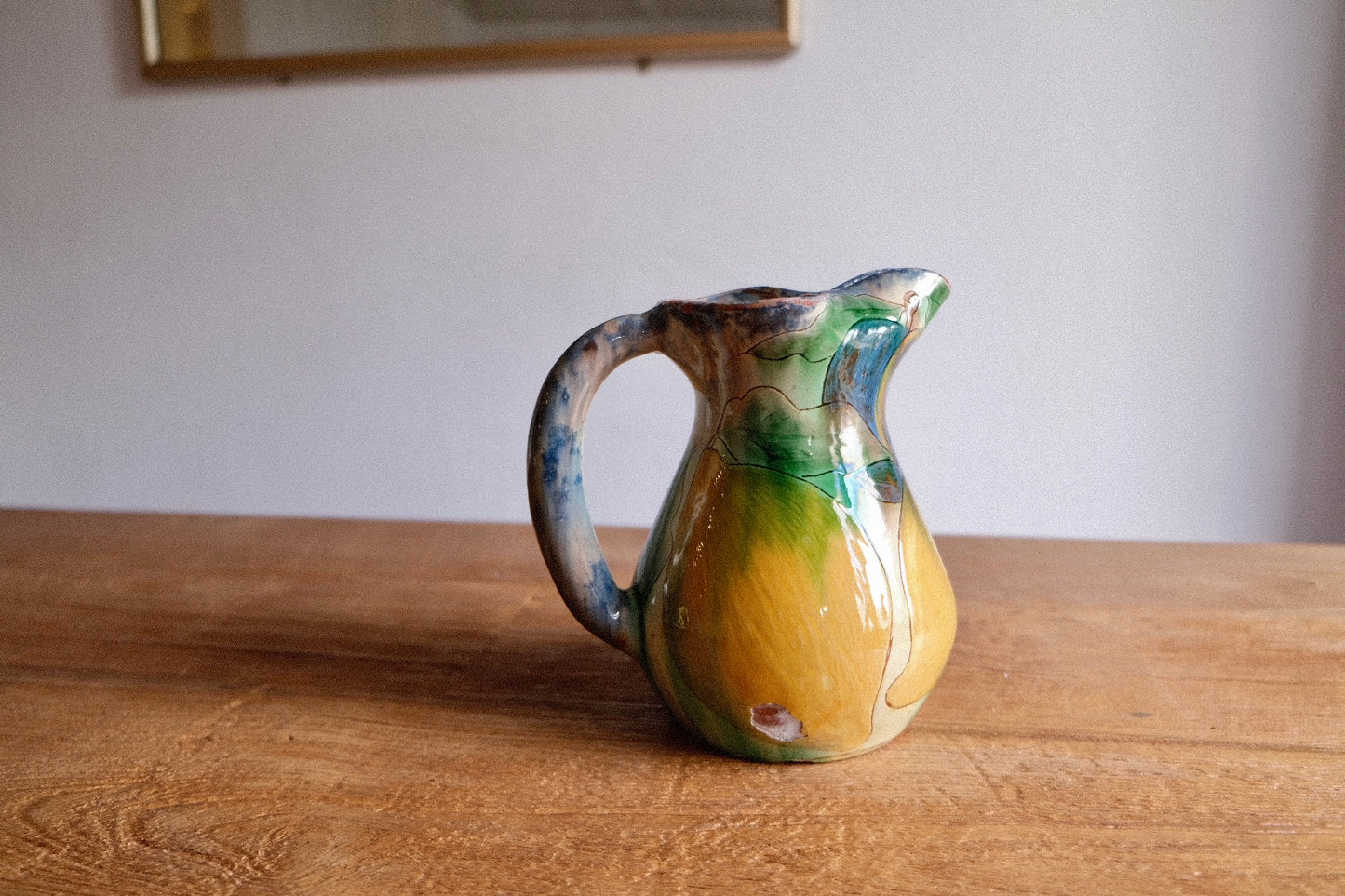 Ceramic jug with lemons and tomatoes