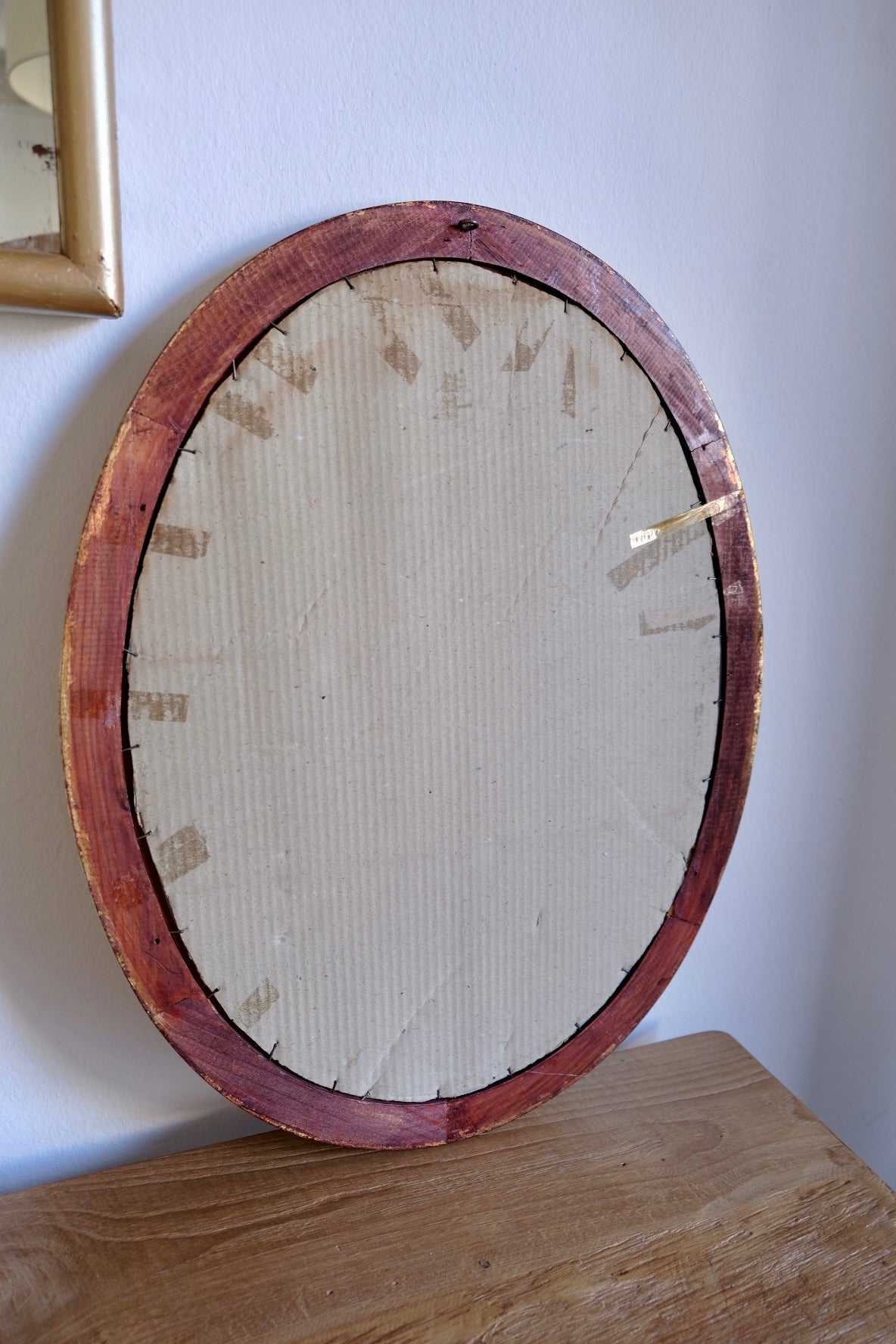 Vintage facet cut oval giltwood mirror