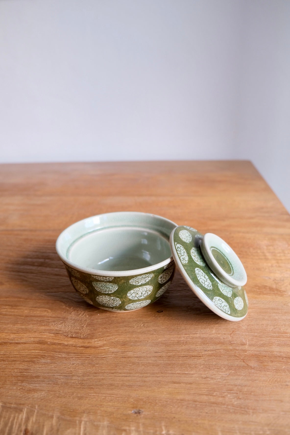 Patterned green bowl with lid