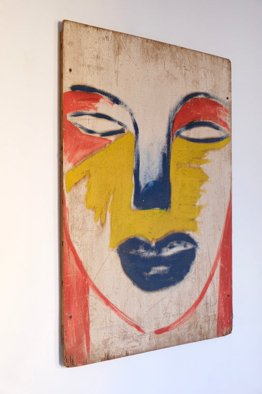 Face on wood panel, Barcelona 1998