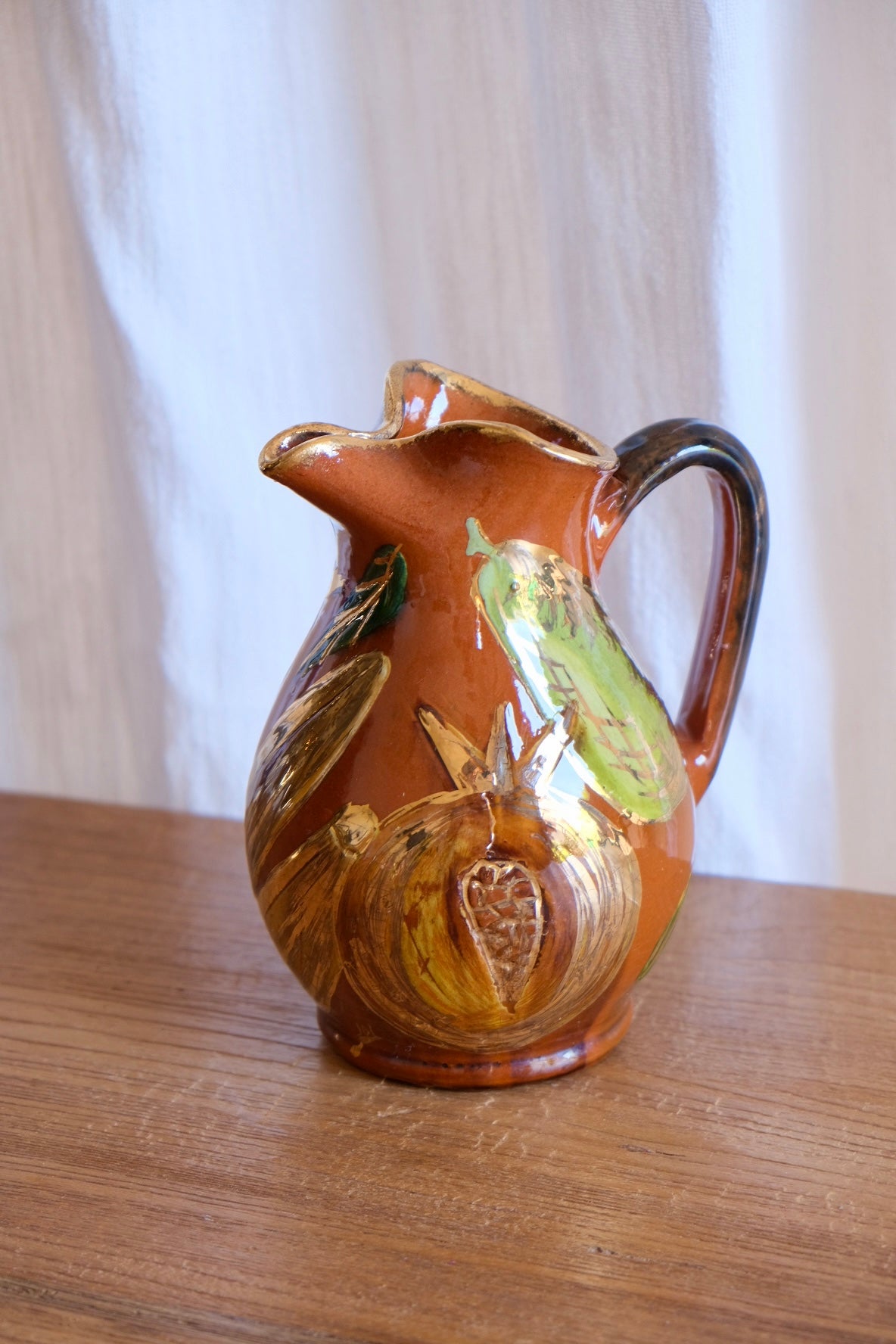 Ceramic jug with pomegranates