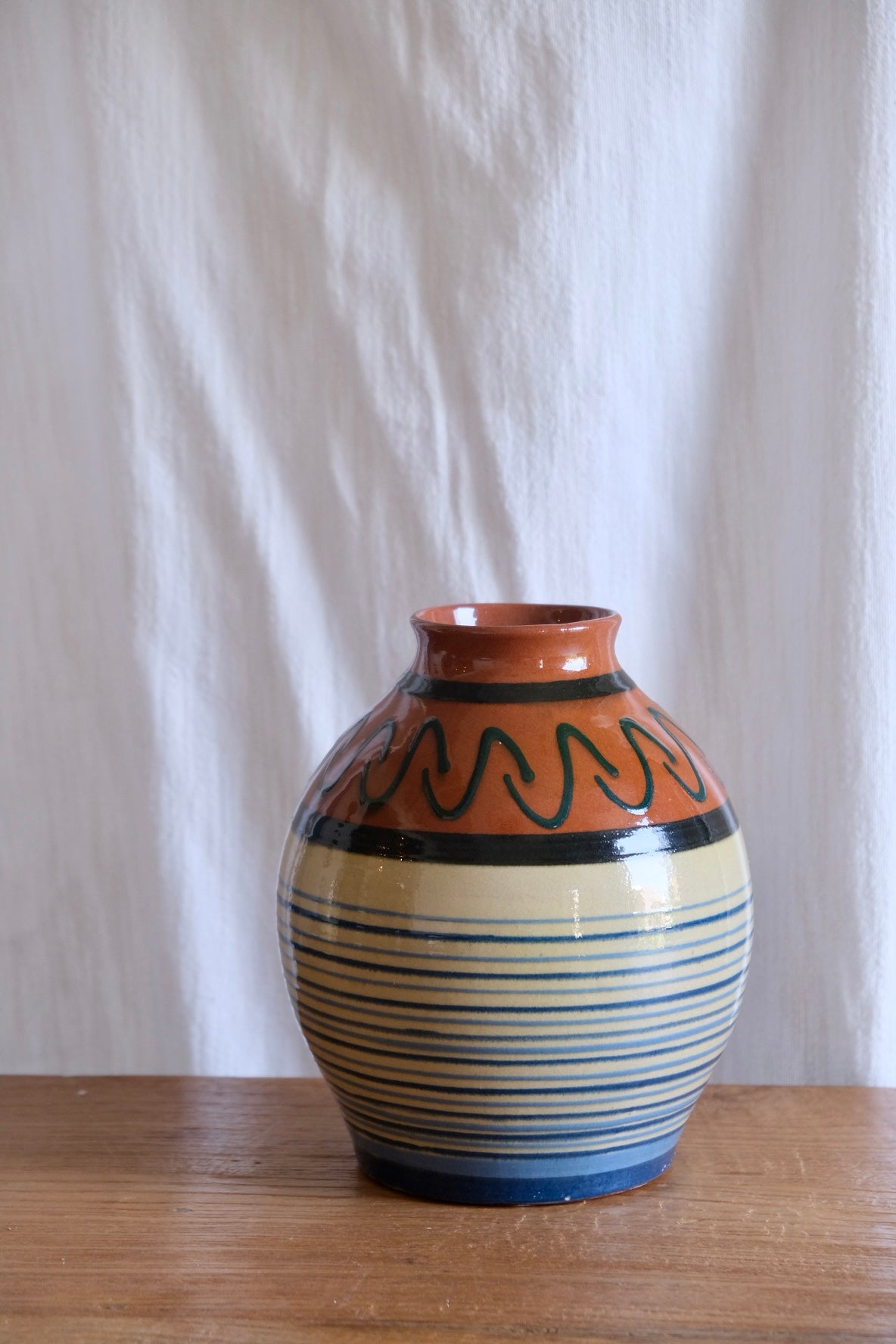 Stripy terracotta vase