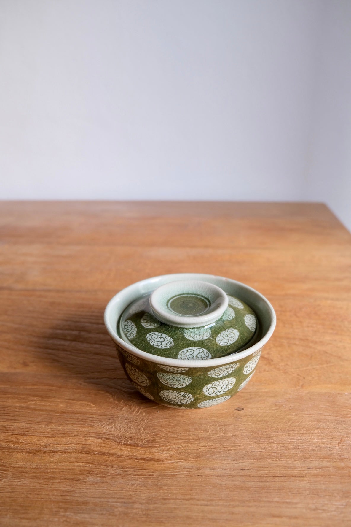 Patterned green bowl with lid