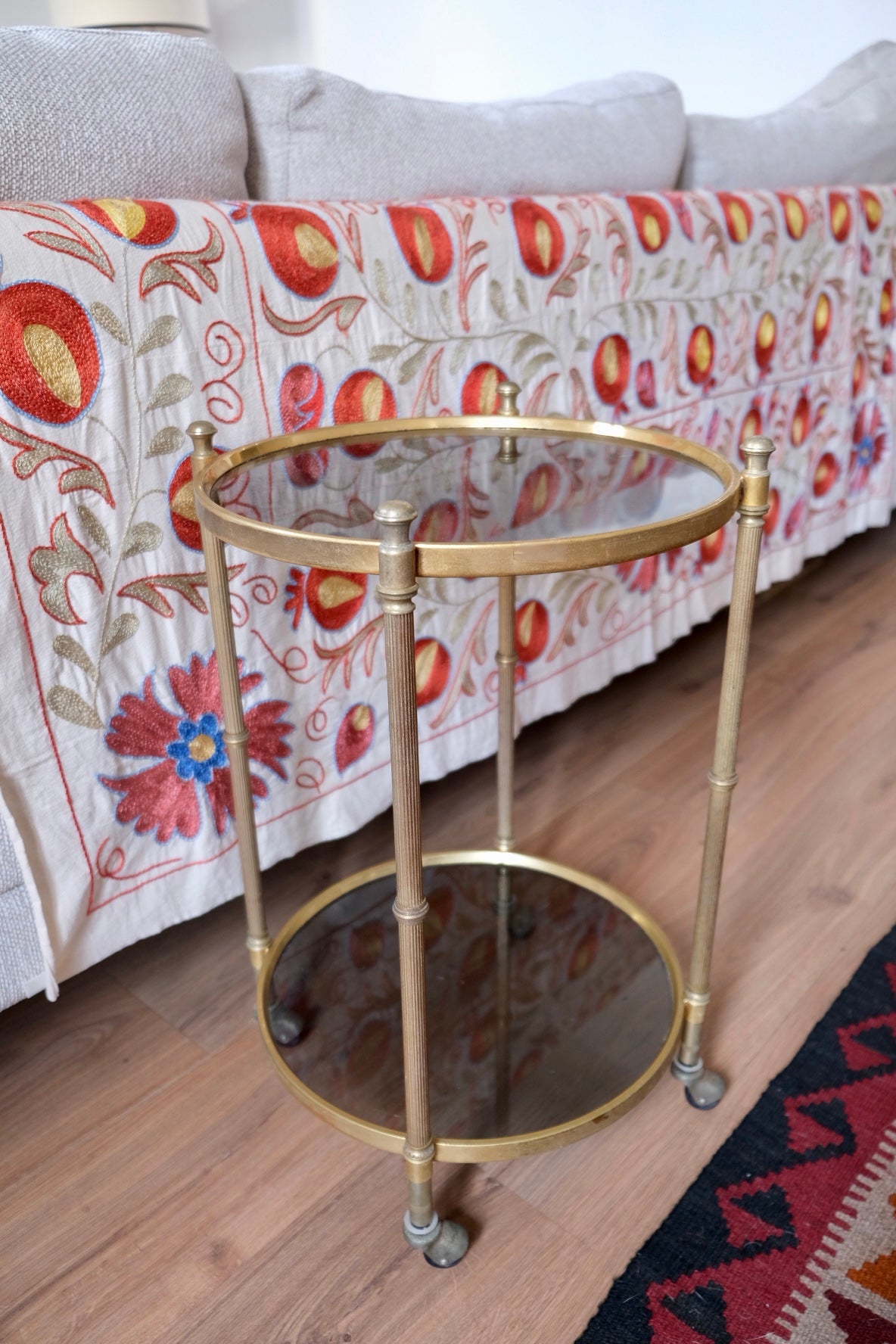 Mid-century drinks trolley/side table with wheels. Brass and smoked glass