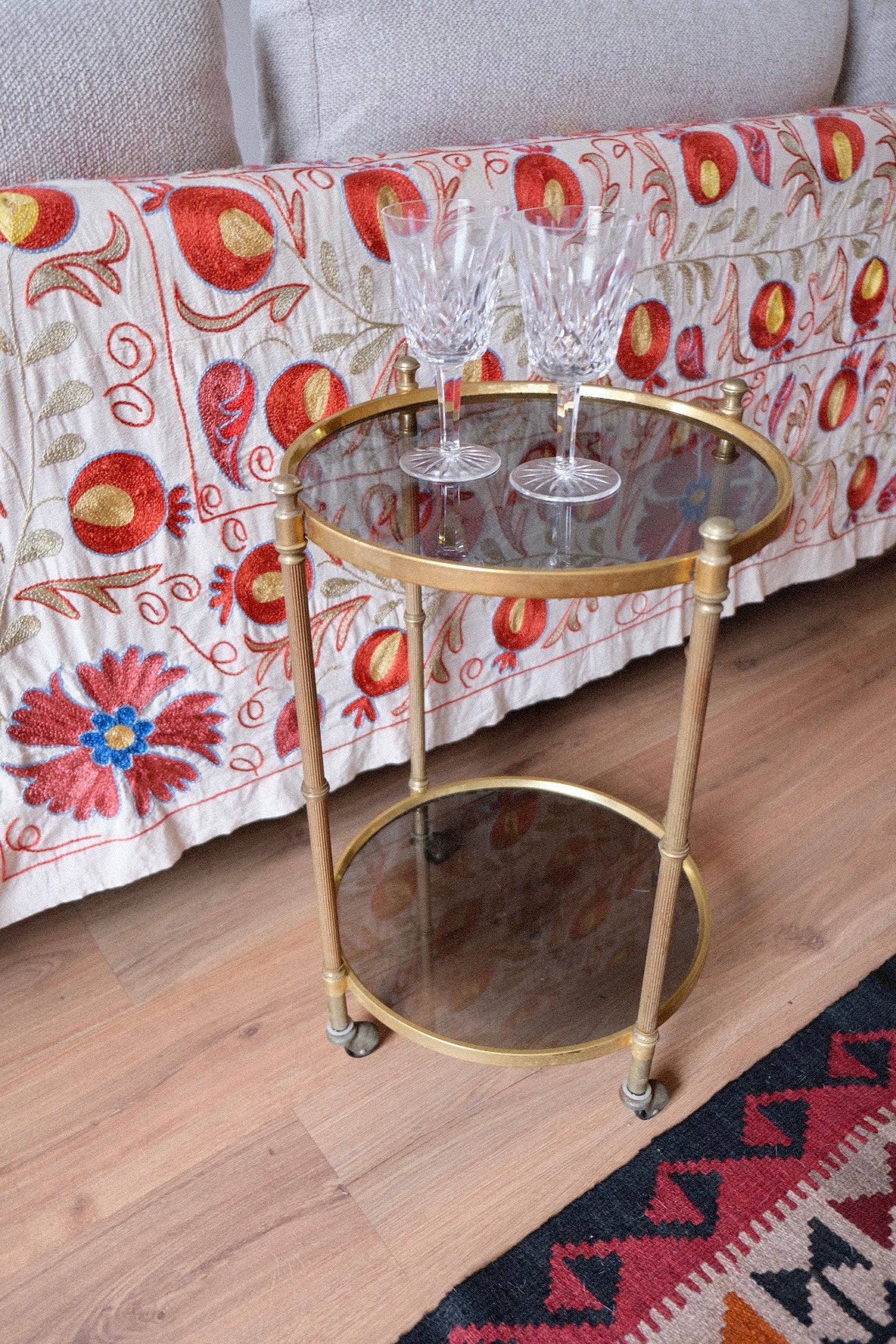 Mid-century drinks trolley/side table with wheels. Brass and smoked glass