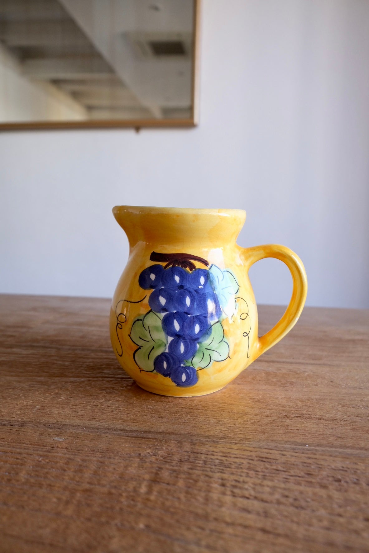 Ceramic jug with hand-painted grapes