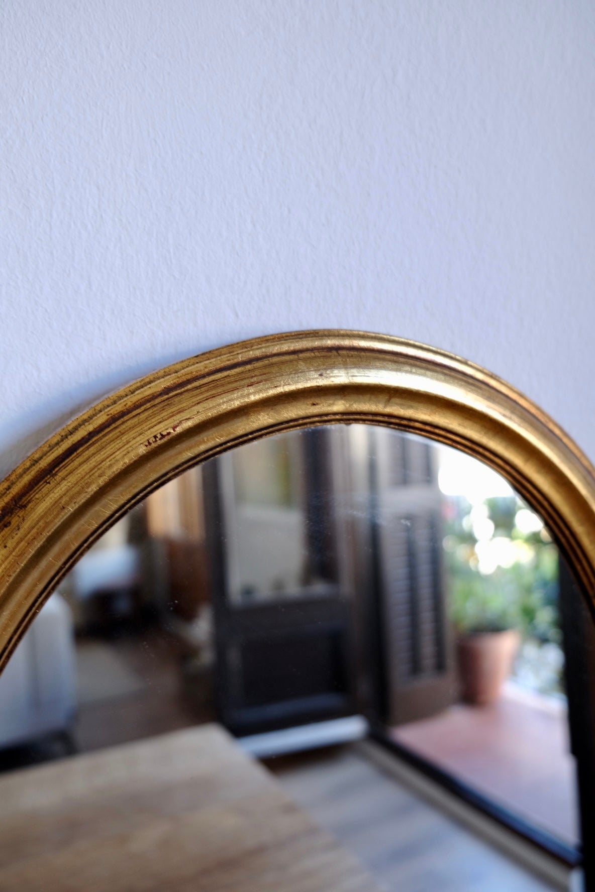 Vintage facet cut oval giltwood mirror