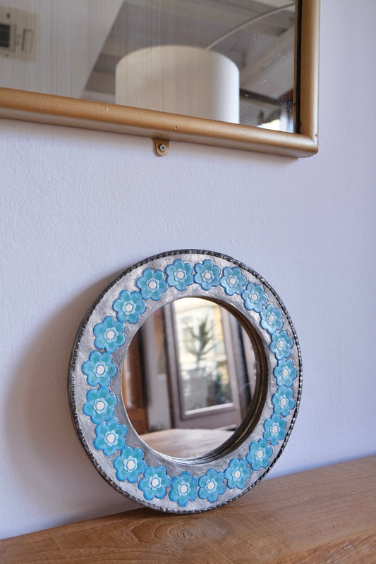 Chunky metal mirror with blue flowers