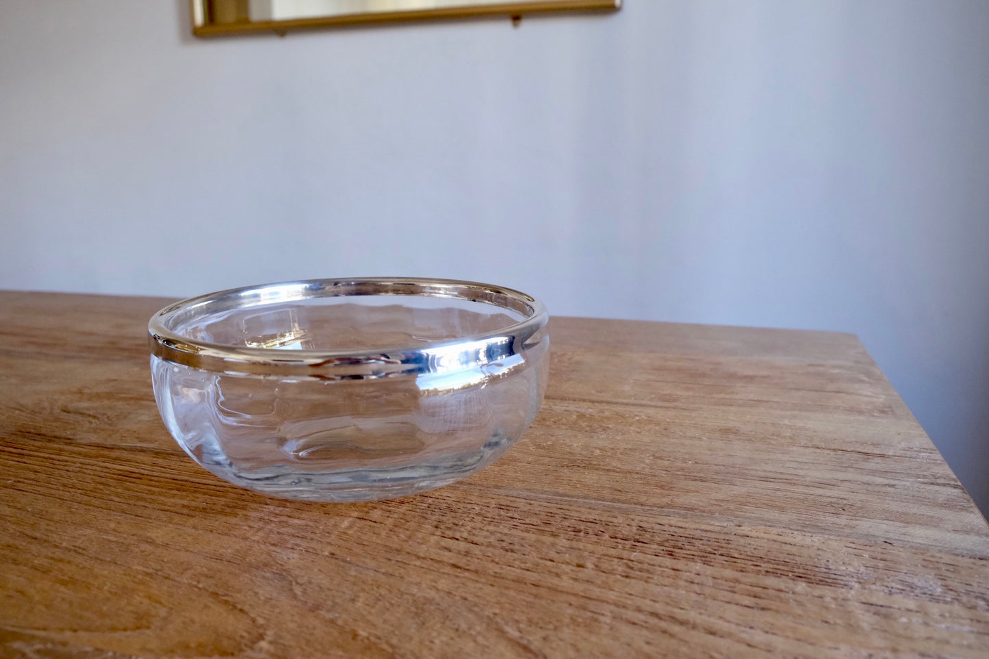 Large glass bowl with silver-plated rim