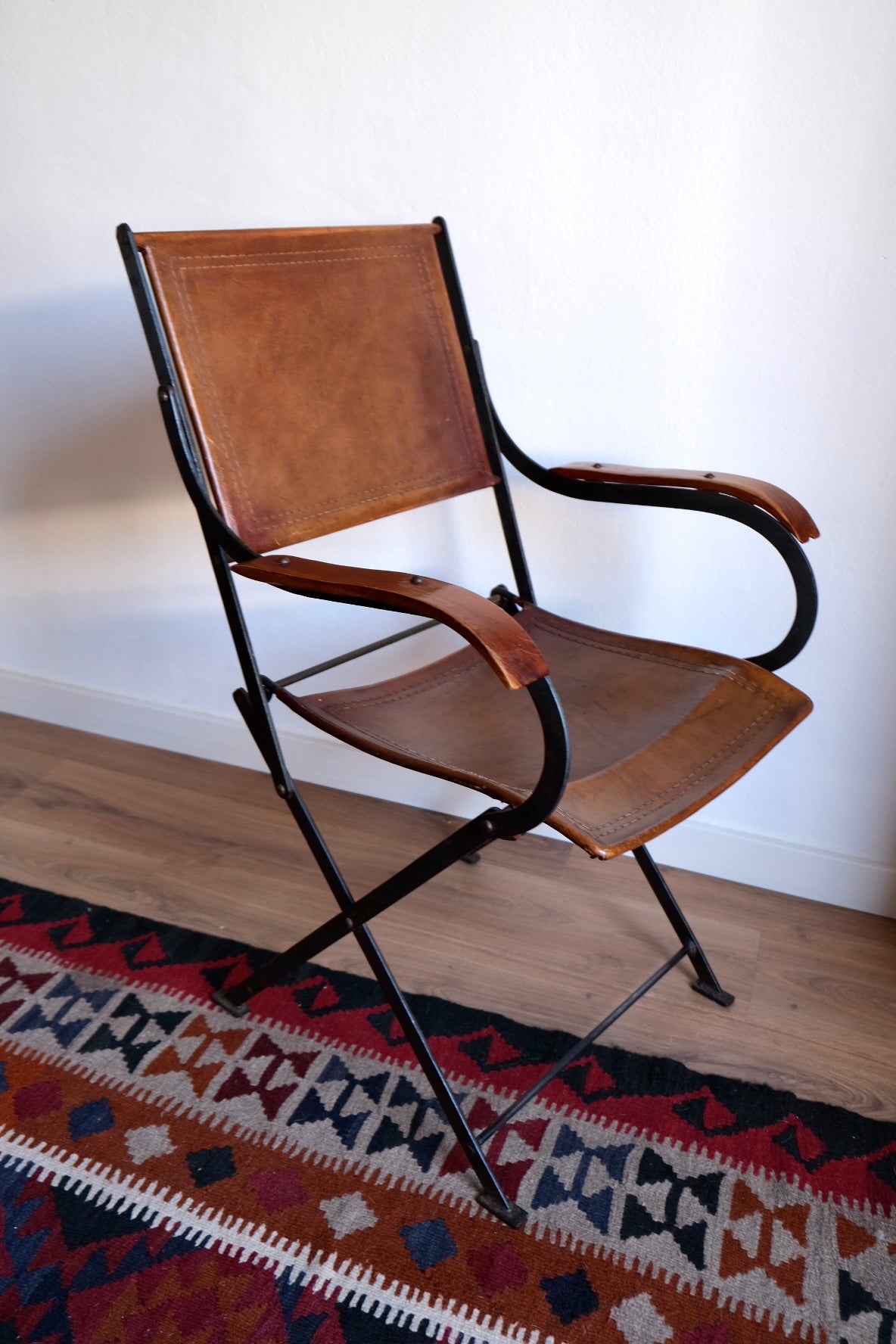 Mid-century foldable chair, leather, wood and iron. France