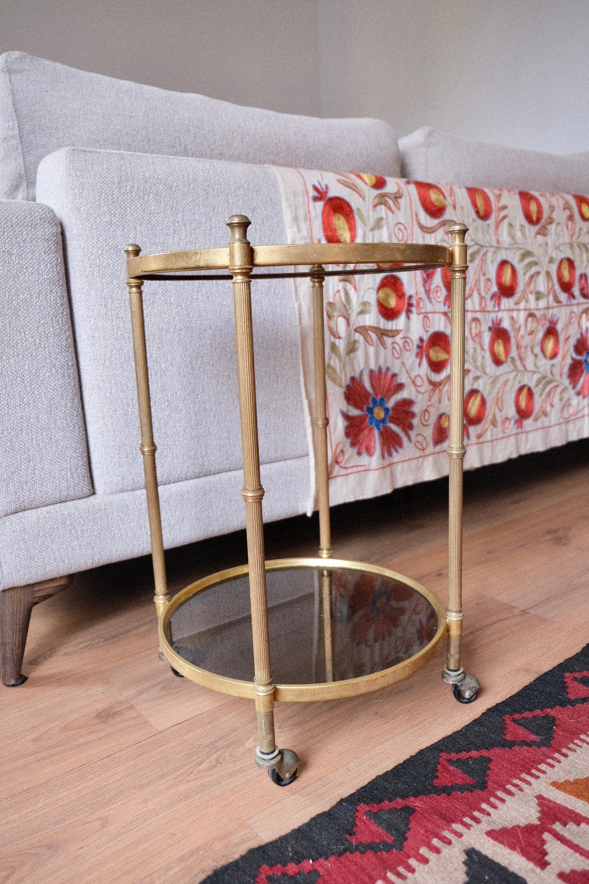 Mid-century drinks trolley/side table with wheels. Brass and smoked glass