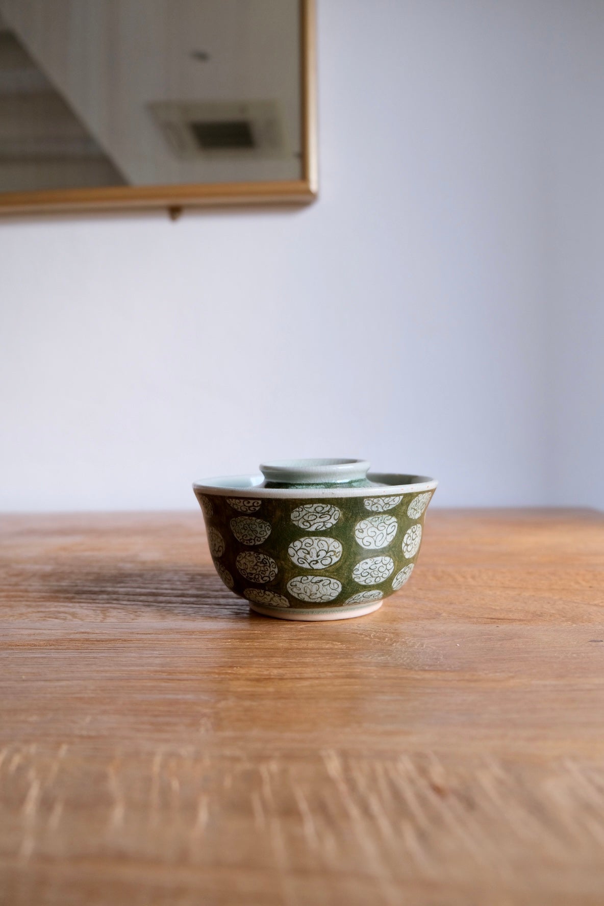 Patterned green bowl with lid