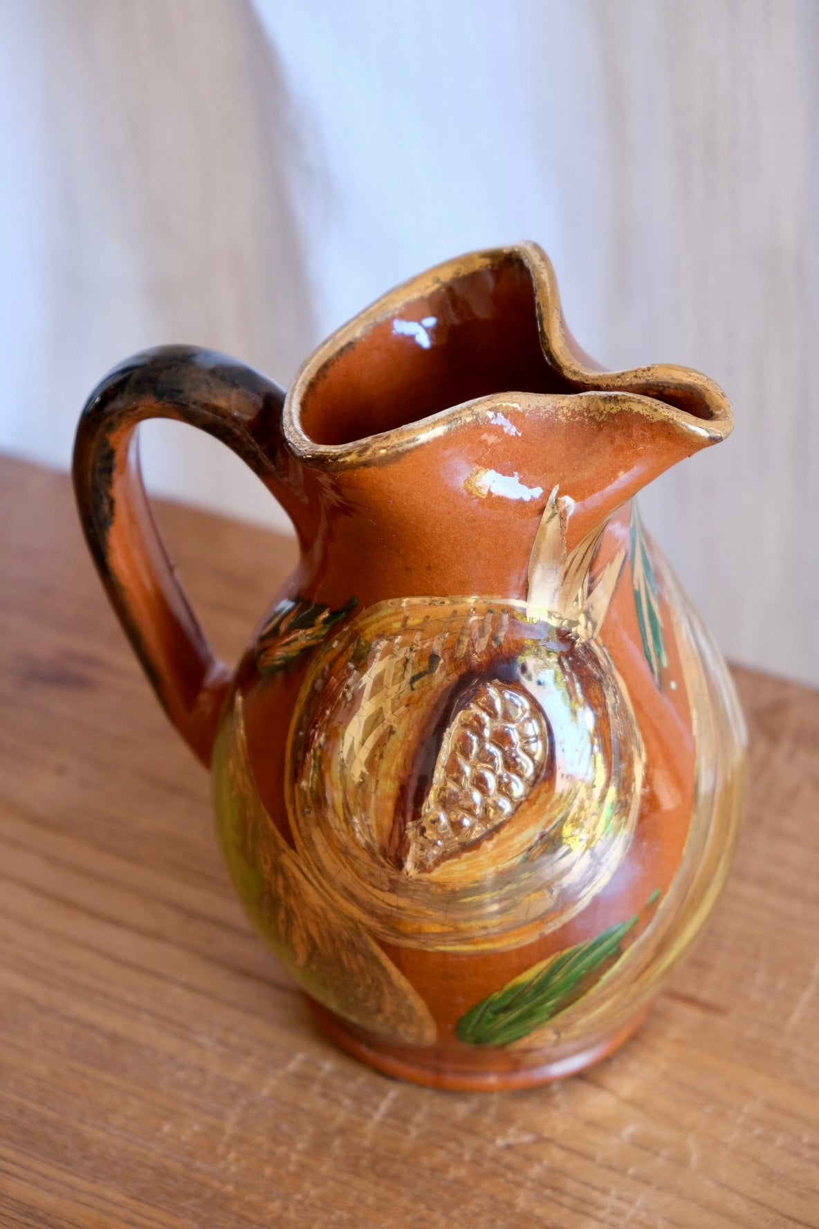 Ceramic jug with pomegranates