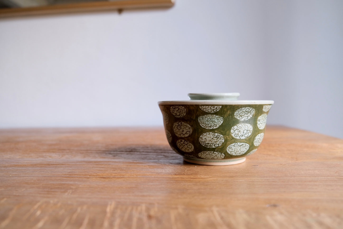 Patterned green bowl with lid