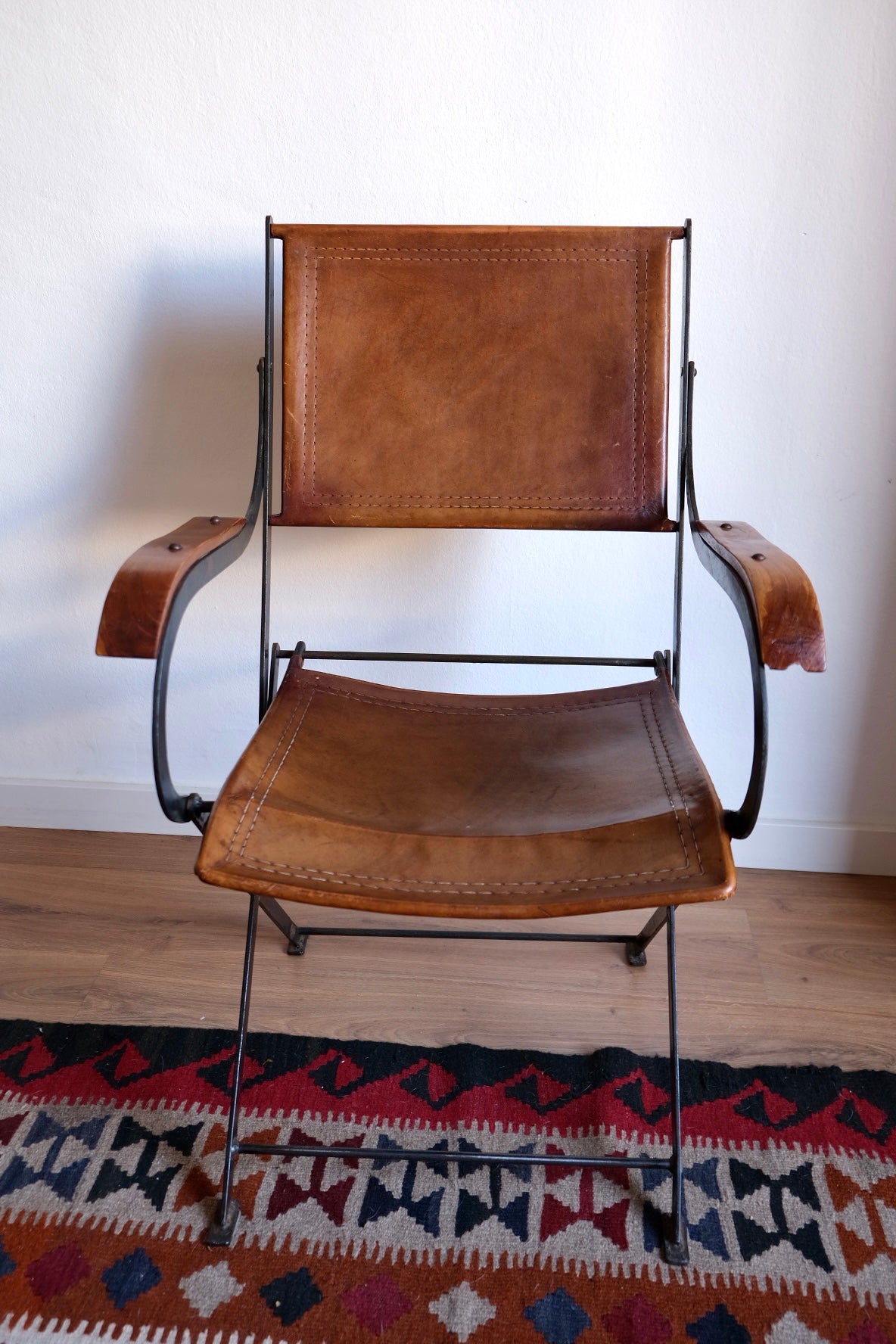 Mid-century foldable chair, leather, wood and iron. France