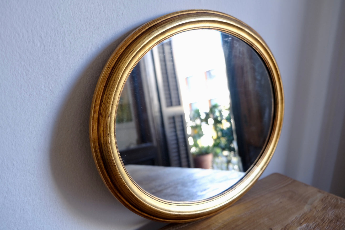 Vintage facet cut oval giltwood mirror