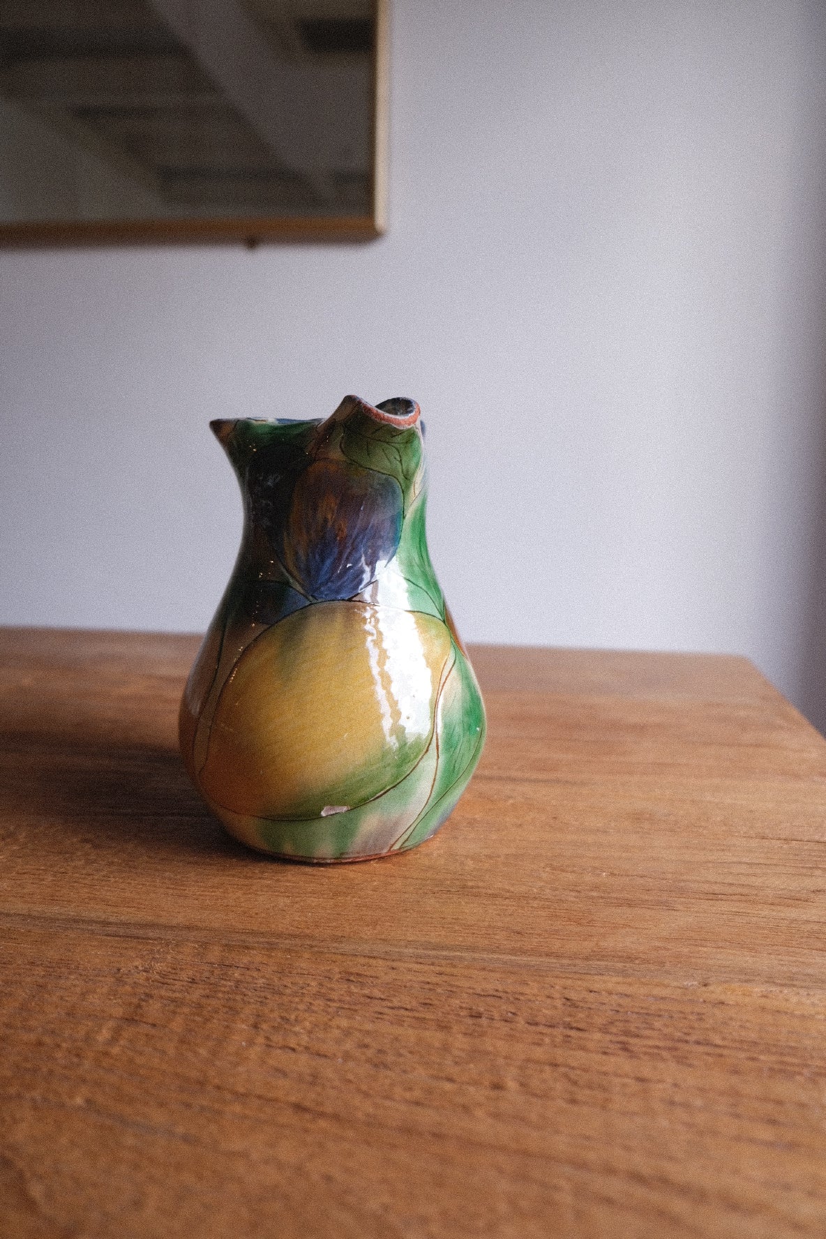 Ceramic jug with lemons and tomatoes